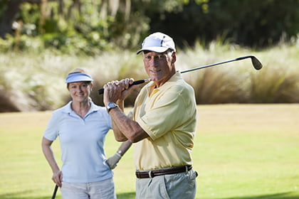 Senior couple playing golf - Parkwood Place